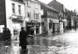 Compton under water 1965 (Shops then are Compton Cafe now Benny Pizza and Sheila Spencer's shop now dentist. The first building was demolished. 